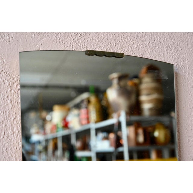 This mid-century modern mirror, with its retro Scandinavian style, will add a touch of vintage charm to the walls of a...