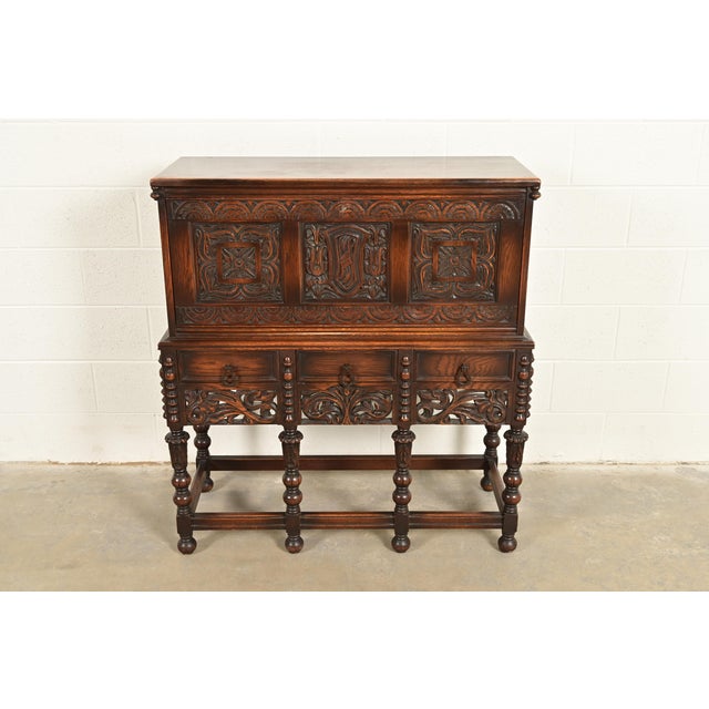 A gorgeous antique English Jacobean or Renaissance Revival style drop front secretary desk By Lifetime Furniture USA,...