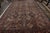 Hand knotted in wool originating circa 1890-1900, this 10x17 antique rug connotes an exceptionally rare Persian Bidjar rug...