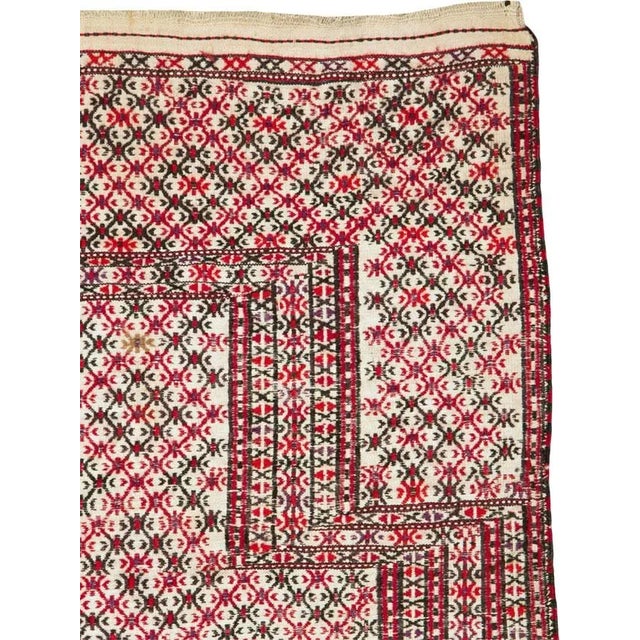 An antique Central Asian Turkoman flatweave Kilim throw rug, with a shabby chic distressed appeal, handmade during the...