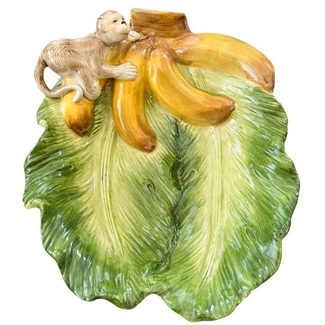 Whimsical vintage majolica platter by Kaldun & Bogle from the Zanzibar collection, featuring a sculptural monkey perched...