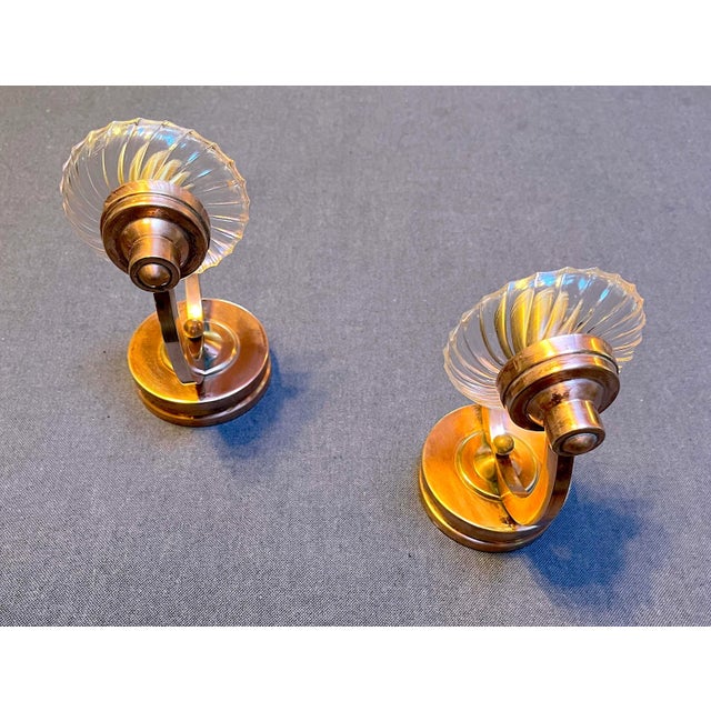 This charming pair of Art Deco sconces in polished brass, is originally from France, circa 1930. Featuring elegant...