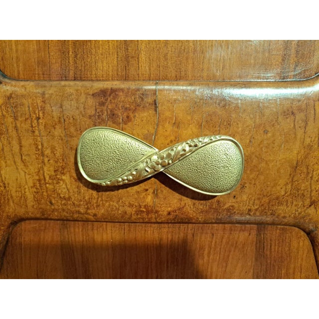 Mid-century Cocktail bar attributed to Paolo Buffa Cocktail bar in walnut and mixed exotic woods. Three panel door open to...