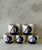 Set of 5 white ceramic napkin rings with blue sailboat on either side. Cute addition to your next nautical themed dinner!