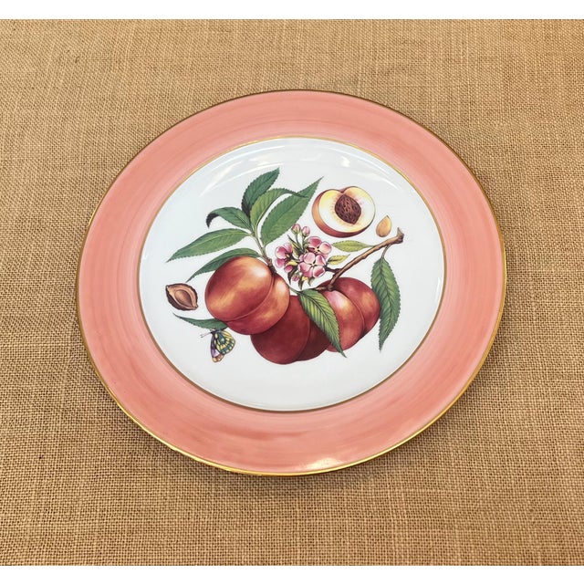 This Email de Limoges serving platter, features a beautifully detailed illustration of ripe peaches with verdant green...