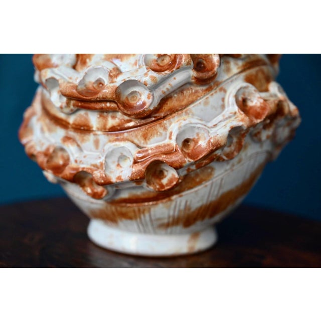 Wild and generous, this Italian studio vase from the 1960s commands attention with its striking sculptural presence. Its...