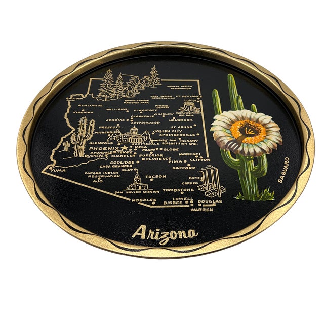 A wonderfully graphic and highly collectible mid-century Arizona souvenir tray, featuring a striking black lacquered...