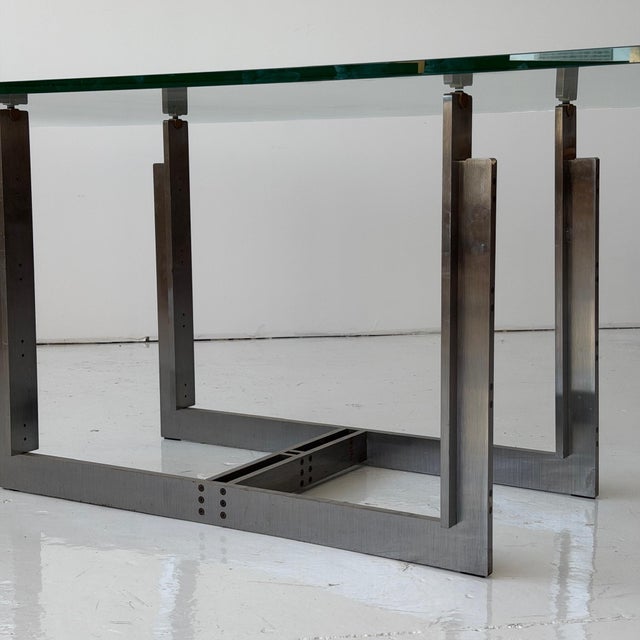 c. 1970s. Italy. Reversible metal base with glass top This piece is attributed to the mentioned designer/maker. It has no...