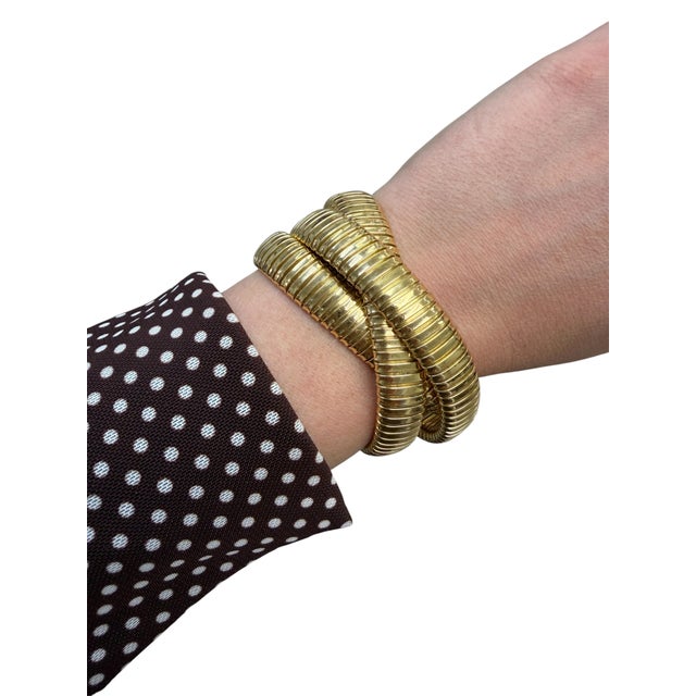 This classic quintessential bracelet by Sidney Garber is designed as three interlocking flexible tubogas bangles....