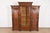 A gorgeous monumental antique Eastlake Victorian or Renaissance Revival triple bookcase cabinet or armoire In the manner...