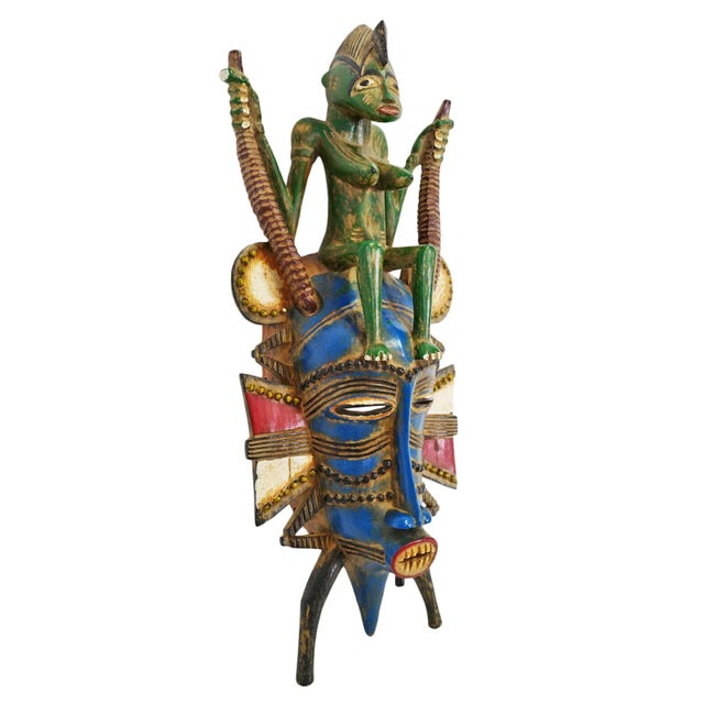 Unique striking colorful painted vintage carved wood mask from South Africa. Interesting green painted female figure sits...