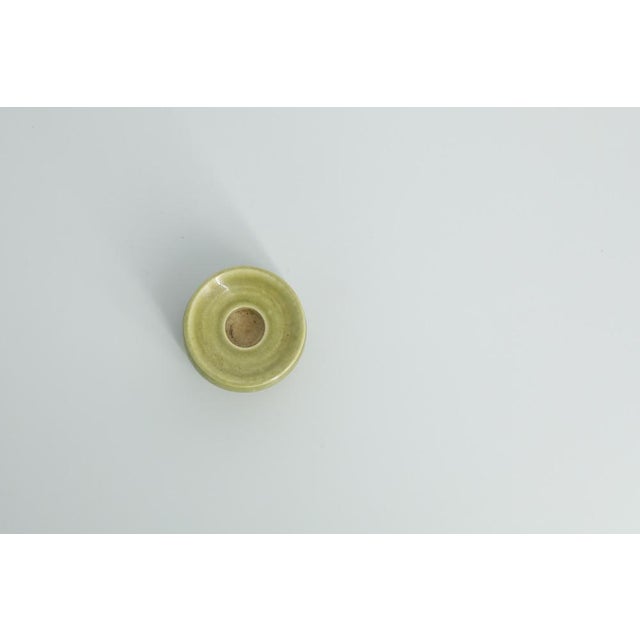 This miniature, collectible stoneware candleholder was made by the Swedish manufacture Gunnars Keramik Höganäs during the...