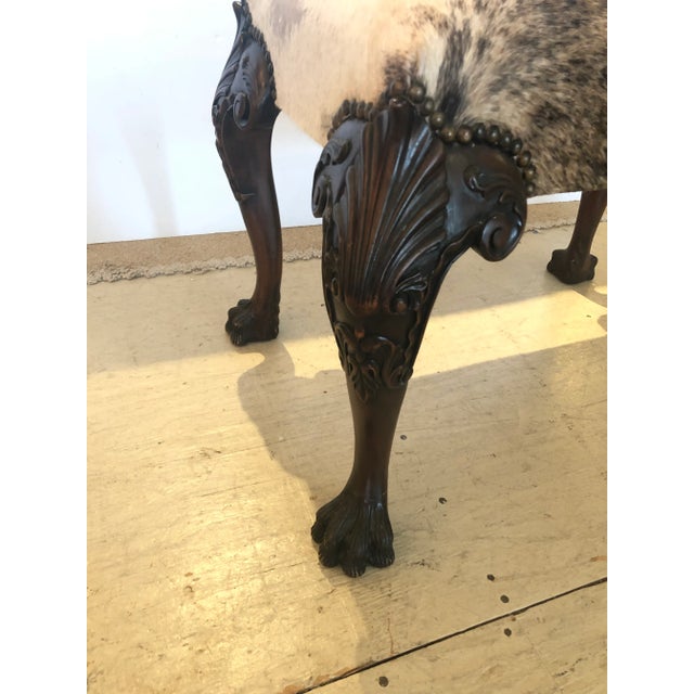 A great looking ottoman having Chippendale style carved mahogany cabriole legs with acanthus leaf decoration and claw...