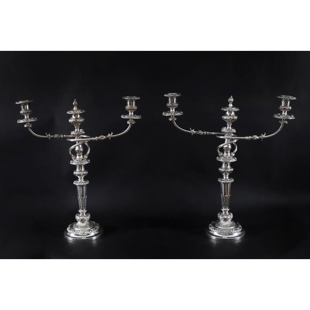 This is a stunning antique suite of candleabra comprising a large pair of English Old Sheffield plate silver on copper...