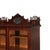 An Arts & Crafts oak bookcase, dating to approximately 1910, presents a classic form with functional elegance. The piece...