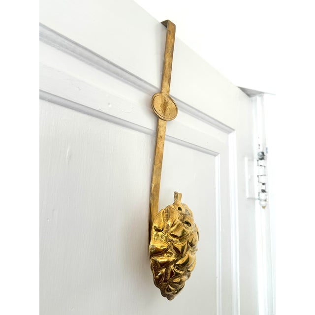 Add a touch of rustic charm to your home with this vintage brass over-the-door hanger featuring a beautifully detailed...
