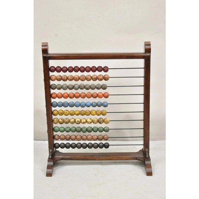 Large Vintage Mongolian Wooden Math Abacus with Painted Wooden Balls. Item features painted wooden balls in red, pink,...