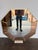 This elegant mirror is a masterclass in texture and warmth, featuring a sophisticated interplay of materials. The frame is...