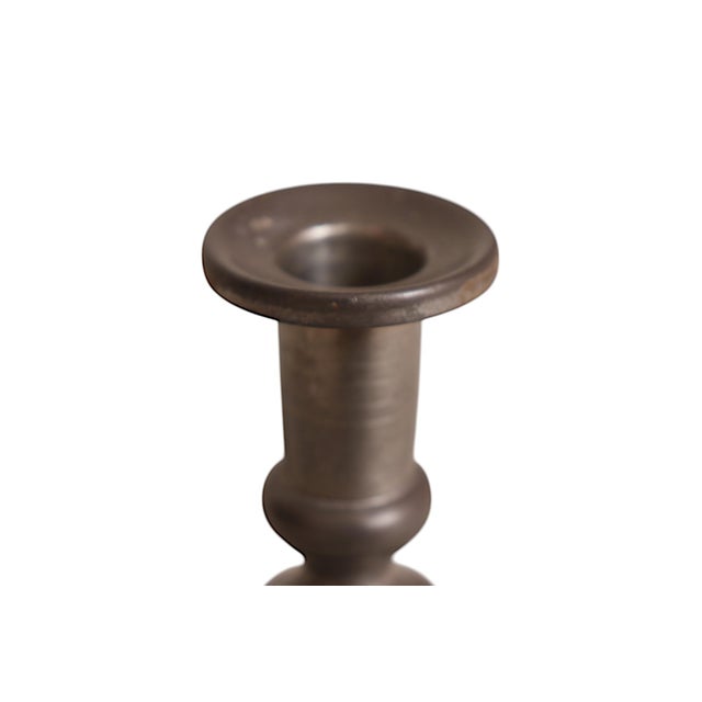 A pair of 1960’s pewter candlestick holders made by Woodbury Pewterers of Woodbury, CT. Simple capitals top tall capitals...