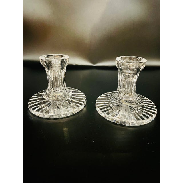 Beautifully crafted & iconic! This light-cathcing set of Waterford Crystal candle holders are substantial and beautifully...
