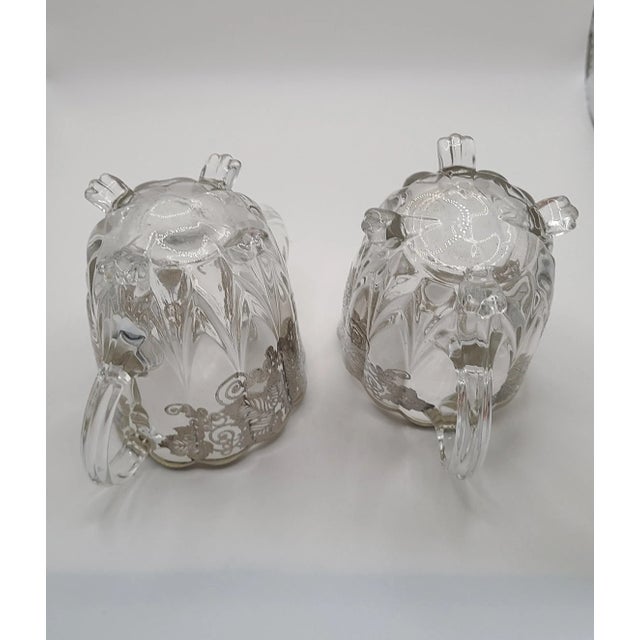 A pair of glass silver onlay grapevine pattern for the sophisticated traditional coffee/tea service. Attributed to Silver...
