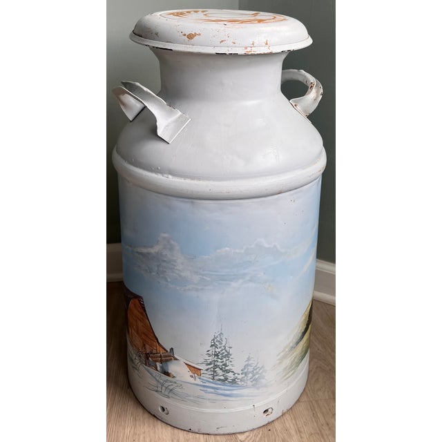 Authentic vintage metal milk can from Roger Dairy of Dayton, Ohio, featuring a charming pastoral landscape graphic with...