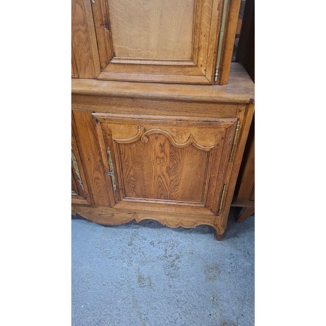 A two-part solid oak buffet dating from the late 19th century. This buffet has two drawers in the upper section. It can be...