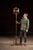 Tall wrought iron floor candelabra with dramatic Gothic Revival styling, featuring a slender central shaft rising from a...