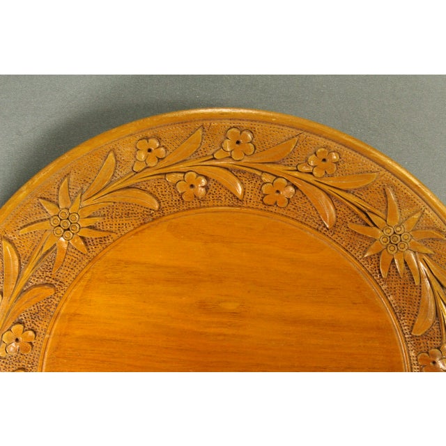 A very beautiful wooden plate Black Forest style carving with edelweiss blooms and other wild Alps flowers Early 20th...