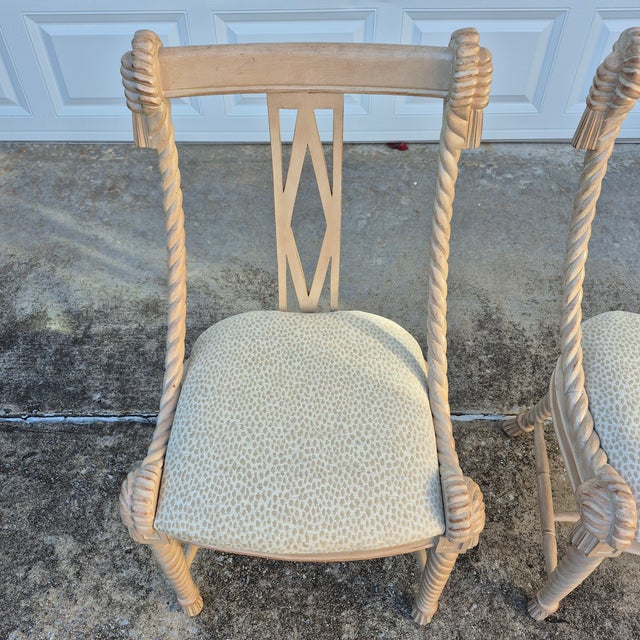 This is a pretty pair of Napoleon III carved wood rope and tassel side chairs manufactured by Andre Originals in the...