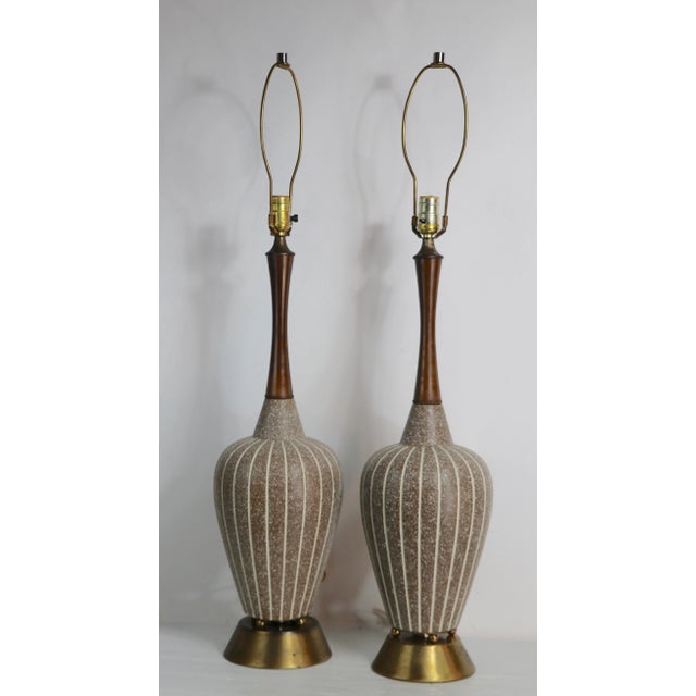 Stylish pair of Mid Century table lamps, having striped bodies, teak necks and brass bases. Both are in very good, clean...