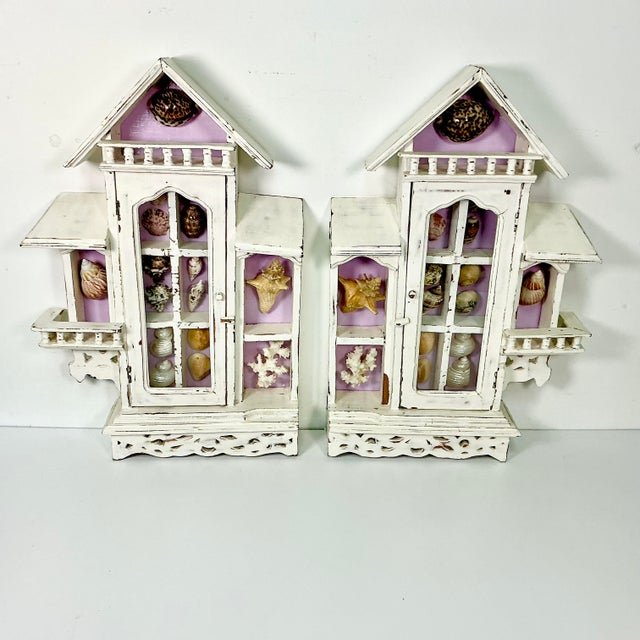 Vintage Home is pleased to present a pair of vintage Beach House Shadowboxes filled with a Seashell Collection. The...