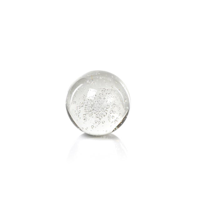 Strikingly simple, our gorgeous glass orb set reflects light with its unique internal bubbling and brilliant surface....