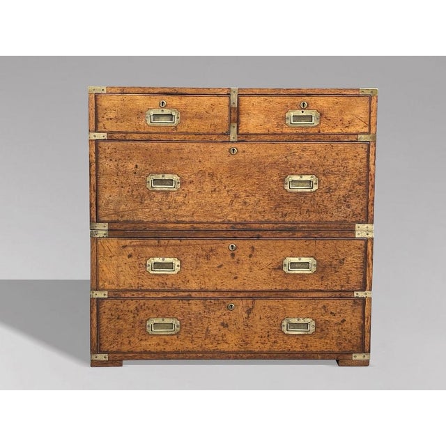 A Handsome 19th Century Oak British Military Officer's Campaign Chest of Drawers This striking mid-19th-century oak...