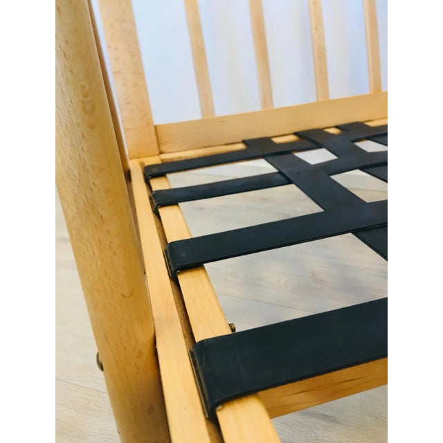 The chair was restored, have new cushions and upholstery. Wood is beech. This piece has an attribution mark, I am sure...