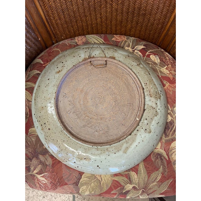 Large pottery handmade stoneware decorative bowl /platter featuring a blue and grey glazed design with iron spots. The...