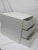 White A. B. S. plastic storage cube with three drawers and dividers. In the style of PALASET and Kartell. The unit has...