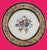 A collection of twelve antique French porcelain dishes featuring polychrome floral decoration at the center and along the...