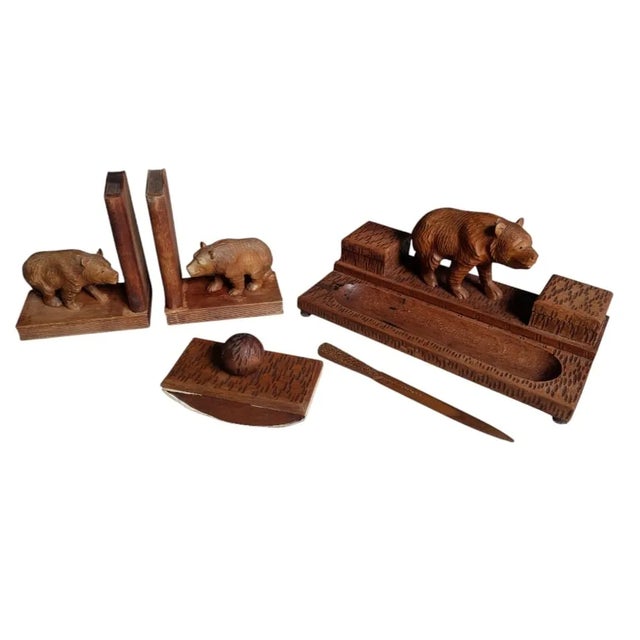 A beautyful desk set of Black forest bear. A print, letter opener, and penholder with fine woodcarved bear and two inkwels...