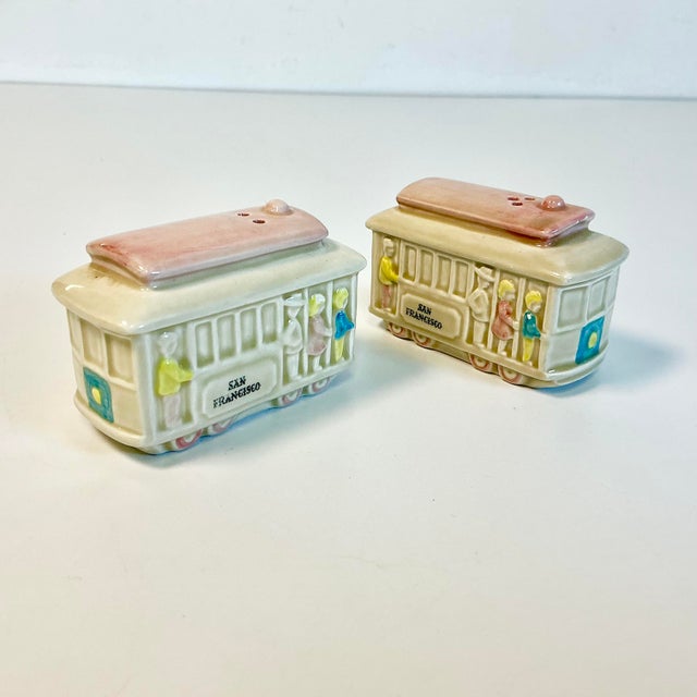 These are charming and whimsical. A pair of San Francisco Cable Car Salt & Pepper Shakers from the 1960s. They feature a...