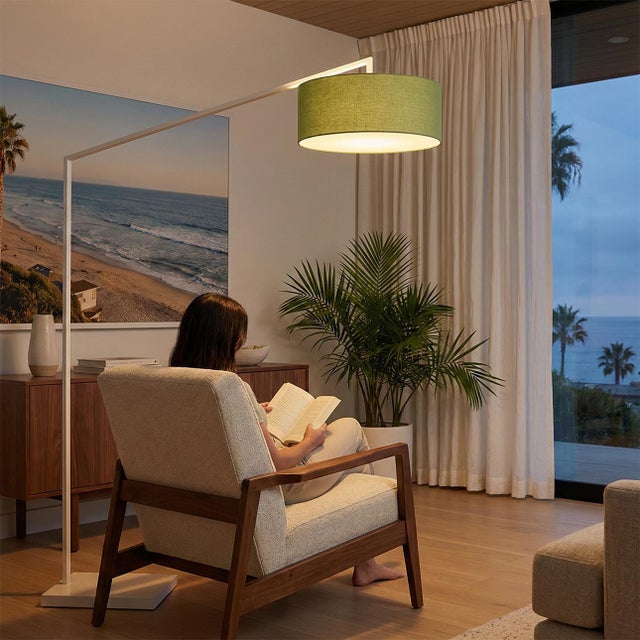 The Stretch Arc Floor Lamp is a modern lighting solution designed by Kirby Groce in 2011. This lamp features a striking...