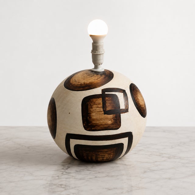 An exceptional Mid-Century Modern spherical table lamp crafted from stoneware in Portugal, dating from the late 1960s to...