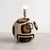 An exceptional Mid-Century Modern spherical table lamp crafted from stoneware in Portugal, dating from the late 1960s to...