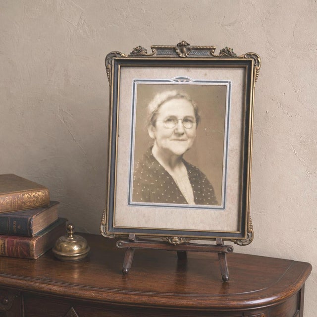 1930s wood picture frame with an ornate gold-tone crest, hand-colored floral accents, original-style glass and a geometric...