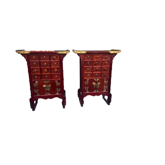 Pair of Asian-Inspired Apothecary Cabinets With Brass Hardware An exceptional pair of Asian-inspired apothecary cabinets...
