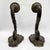 A pair of 18th-century embossed copper arms, mounted on a carved poplar wood core and silvered along the base edge. In...