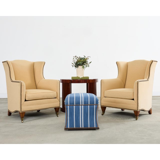 A classic Ralph Lauren Home 'Florence' storage ottoman upholstered in an indigo blue and white striped textile, tailored...