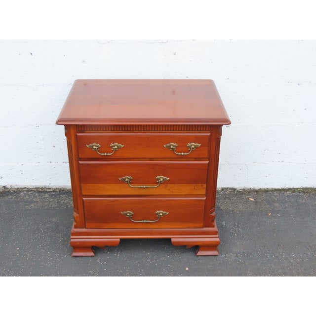 This classic Nightstand is made of wood, solid cherry, and metal. The End Table was made by Tell City Chair Company, Dowry...