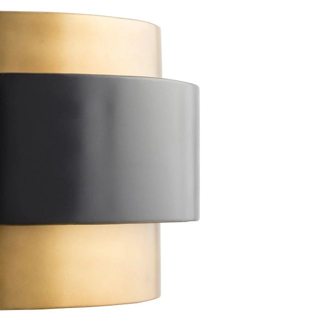 This iron, mid-century-inspired, one-light vintage brass-finished pendant is the perfect light to hang over your dining...