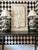Large sculptural botanical wall relief depicting a single iris in a monochromatic ivory-white palette. The deeply modeled...